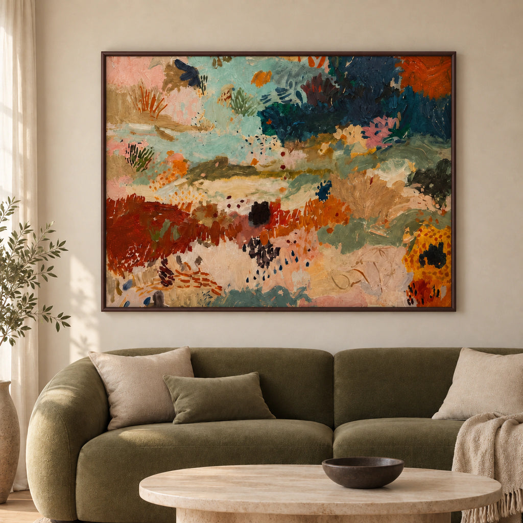 Earth & Tide framed abstract art in aqua, teal and rust tones above an olive sofa in a warm living room.
