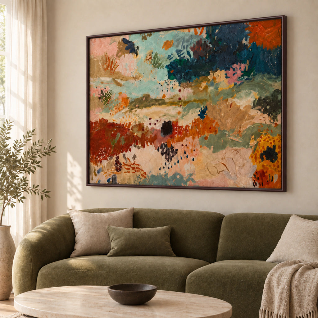 Angled view of Earth & Tide abstract wall art with a thin dark brown frame above an olive sofa.