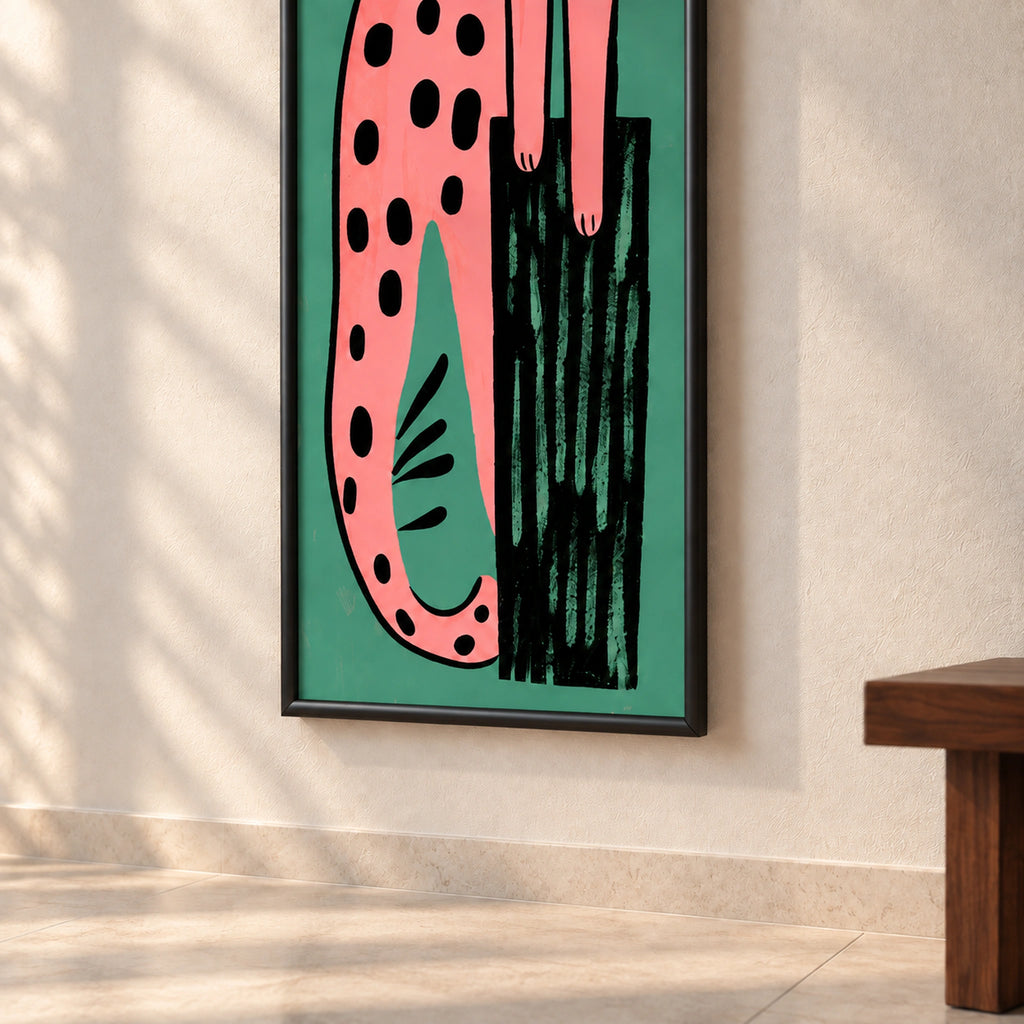 Lower detail of Pink Leopard on Teal wall art showing the curling tail, black tree trunk and rounded black wooden frame.