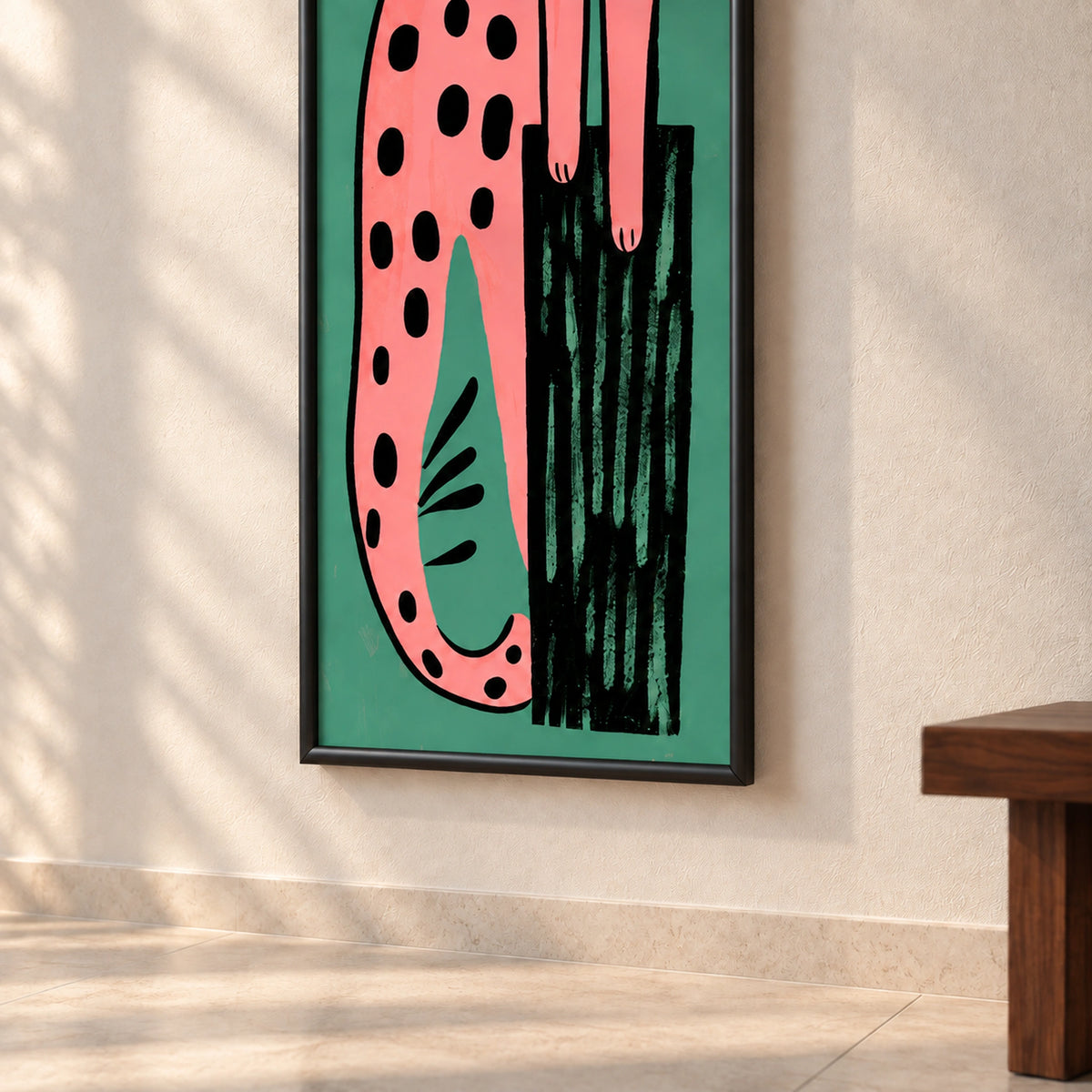 Lower detail of Pink Leopard on Teal wall art showing the curling tail, black tree trunk and rounded black wooden frame.