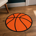 Basketball Mode die-cut rug — classic orange basketball with black seam lines, cut to the circle with black edge binding