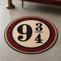 Platform 9¾ die-cut rug — station roundel with 9¾ in black serif on cream, ringed in burgundy and gold, cut to the circle with black edge binding