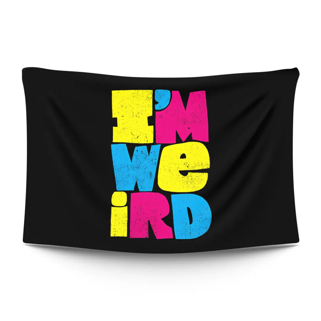 Bold ‘I’M WEIRD’ typographic statement in stark light type on a moody dark backdrop — LoudBorders wall tapestry.