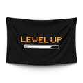 Bold ‘LEVEL UP’ typographic statement in pixel-style type — RPG notification aesthetic, LoudBorders wall tapestry.