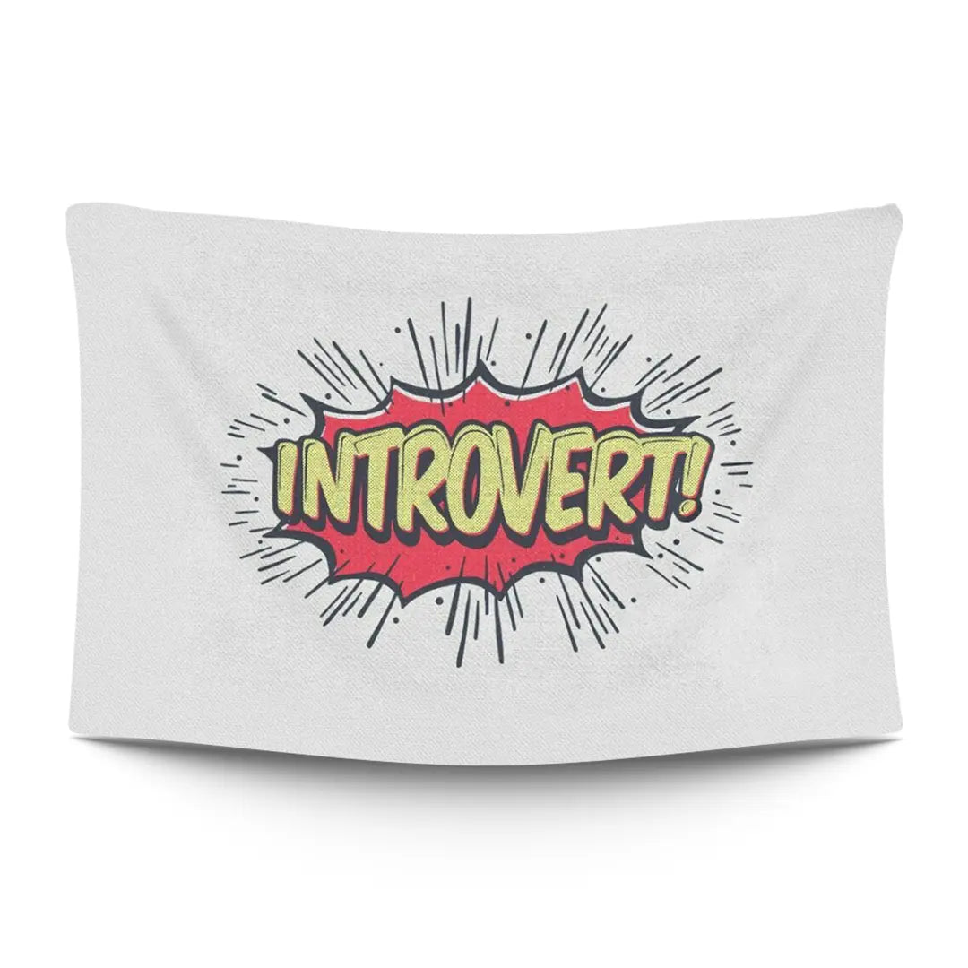 Bold ‘LOUD INTROVERT’ typographic statement in stark light type on a moody dark backdrop — LoudBorders wall tapestry.