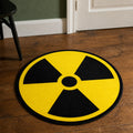 Radioactive die-cut rug — yellow and black radiation trefoil symbol, cut to the circle with black edge binding