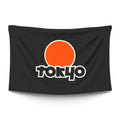 Tokyo skyline with Tokyo Tower silhouette against a swollen orange sun at golden hour — LoudBorders wall tapestry.