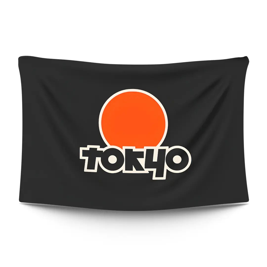 Tokyo skyline with Tokyo Tower silhouette against a swollen orange sun at golden hour — LoudBorders wall tapestry.