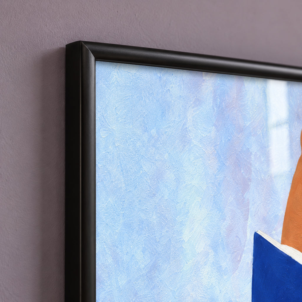 Top-left frame detail of The Sunday Chapter, showing the mitred corner, rounded satin-black profile and pale blue artwork behind reflective glass.