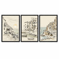 Coastal Sketch set of three black-framed coastal illustrations showing a seaside terrace, village harbour with boats and cliffside buildings on ivory backgrounds.