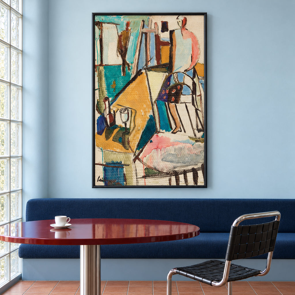 Front view of Studio Reverie in a slim black frame, showing a colourful artist's studio above a blue banquette and red round table.
