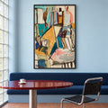 Front view of Studio Reverie in a slim black frame, showing a colourful artist's studio above a blue banquette and red round table.