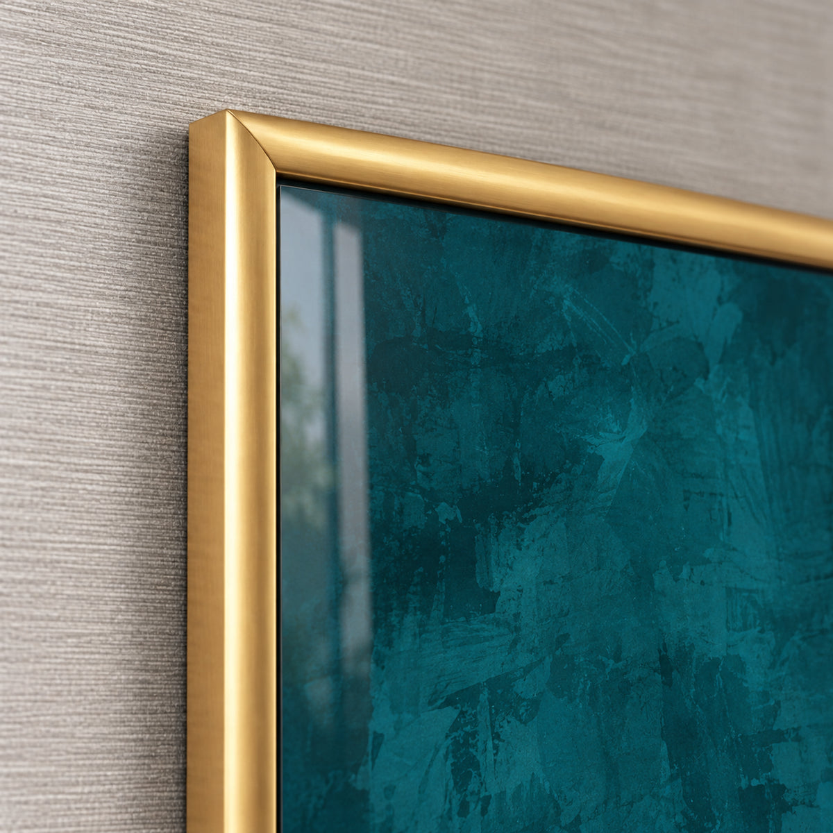 Frame detail of Gilded Flight, showing the rounded gold-toned profile and mitred corner beside the teal artwork.