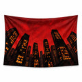 Crimson Skyline wall tapestry with black skyscrapers, amber windows and a textured red sky viewed from below.