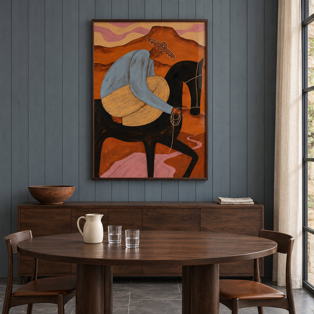 Front view of The Desert Rider, showing a rider in blue and ochre on a black horse against a rust-orange desert, in a dark brown frame.