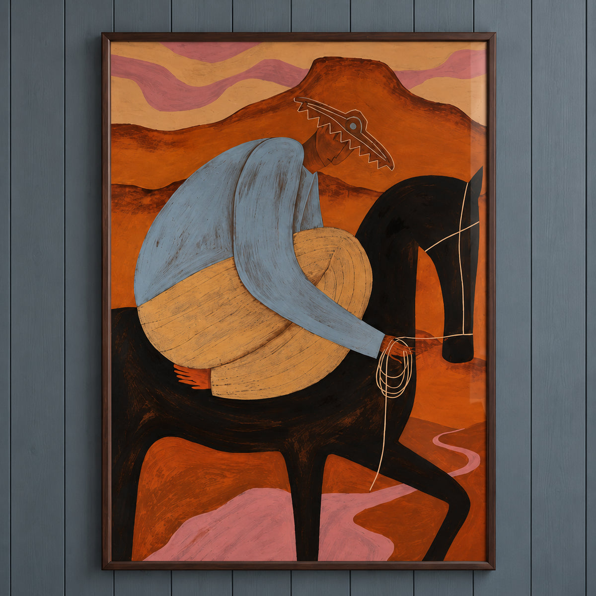 Artwork close-up of The Desert Rider showing the blue-shirted rider, black horse, fine reins and pink trail through orange desert hills.
