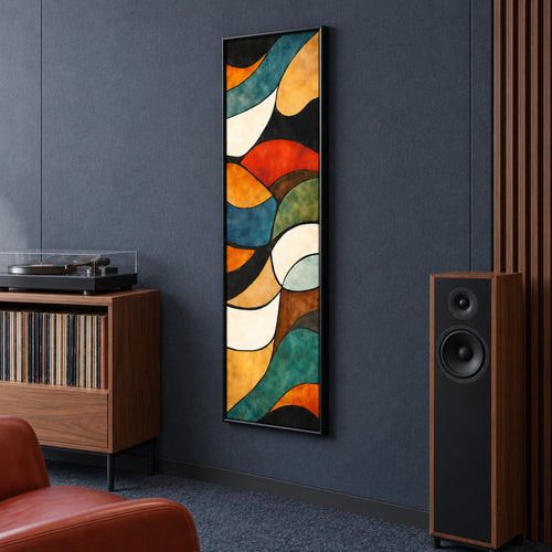 Angled view of Amber Current showing its slim black frame and flowing multicoloured abstract shapes on a dark wall.