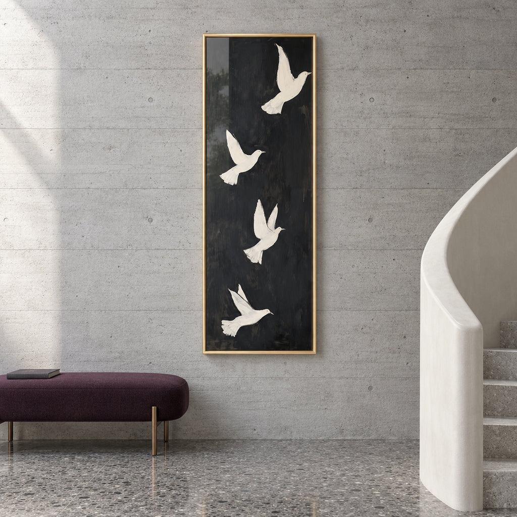 Front view of Quiet Ascent, four ivory doves in flight on a tall charcoal-black background in a gold frame beside a curved staircase.
