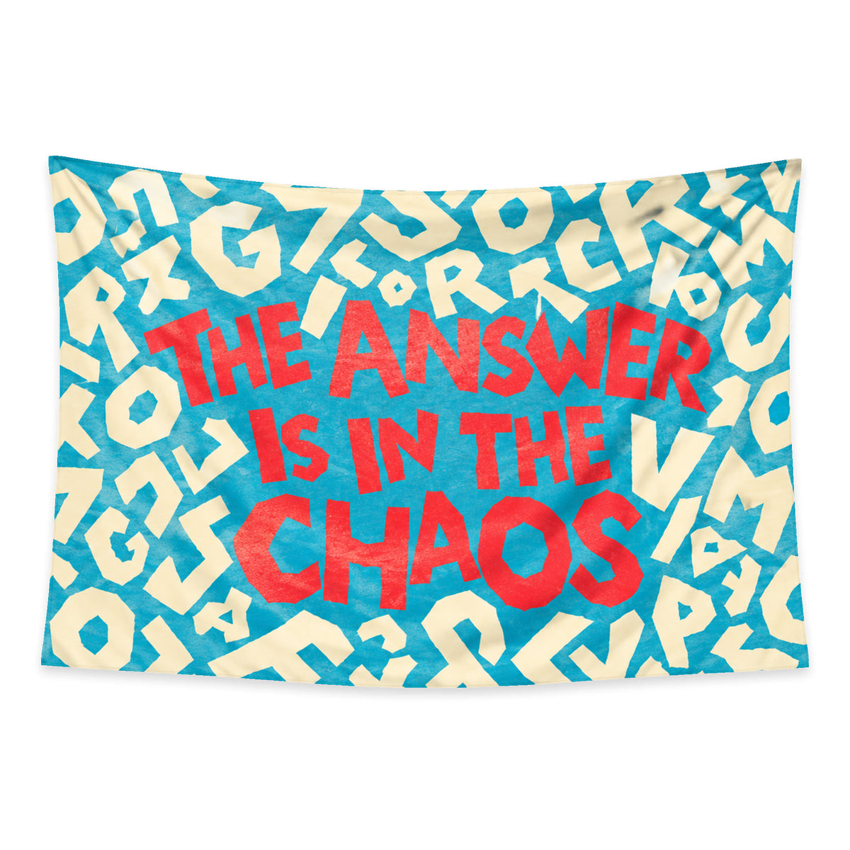 Hidden Order wall tapestry with coral lettering reading The answer is in the chaos and scattered cream letters on turquoise.