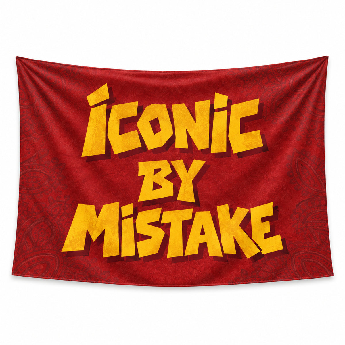 Red Iconic by Mistake wall tapestry with yellow lettering and a paisley pattern.