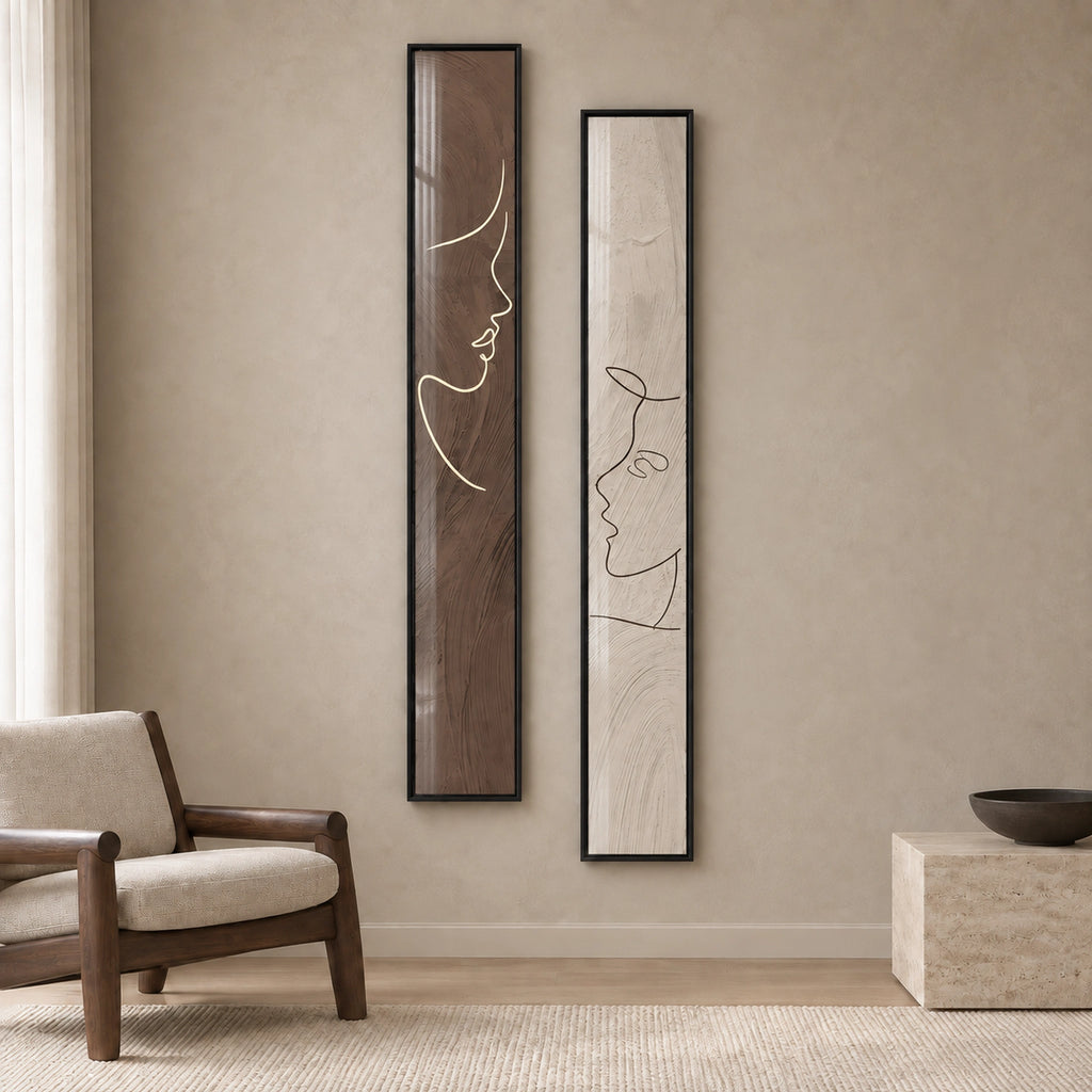 Quiet Dialogue set of two tall brown and ivory line-art portrait prints in thin black frames behind glass, shown from the front.