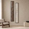 Quiet Dialogue set of two tall brown and ivory line-art portrait prints in thin black frames behind glass, shown from the front.