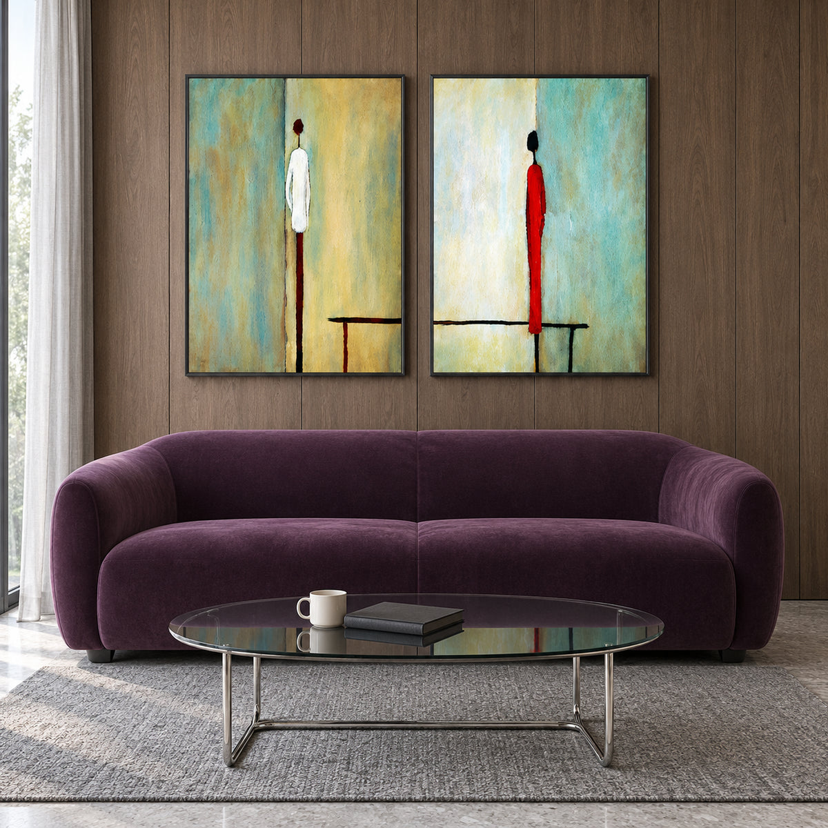 Front view of Between Us: two black-framed artworks with slender ivory and red figures against turquoise, cream and pale yellow, above a plum sofa.
