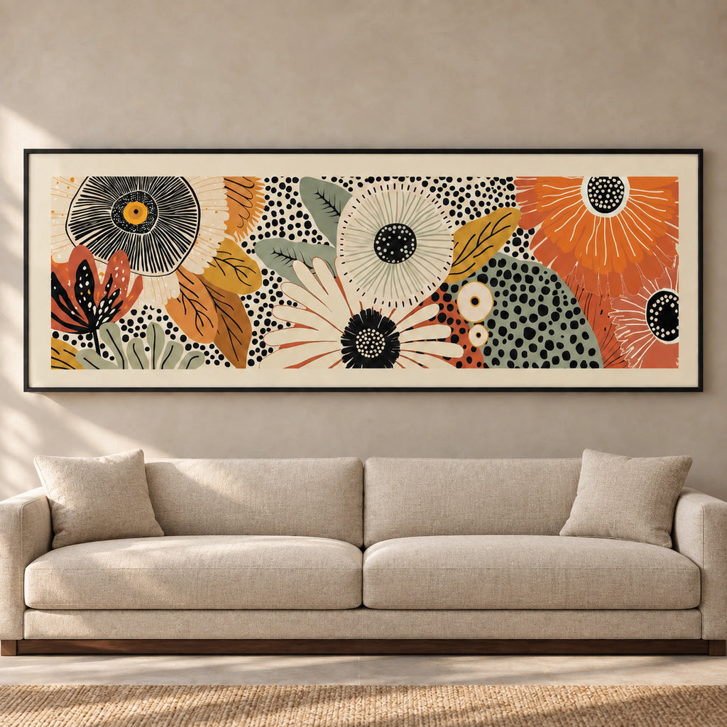Retro Bloom panoramic floral wall art in a thin black frame above a neutral sofa, front view