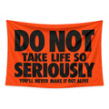 Serious Business wall tapestry with black lettering on orange reading Do not take life so seriously, you'll never make it out alive.