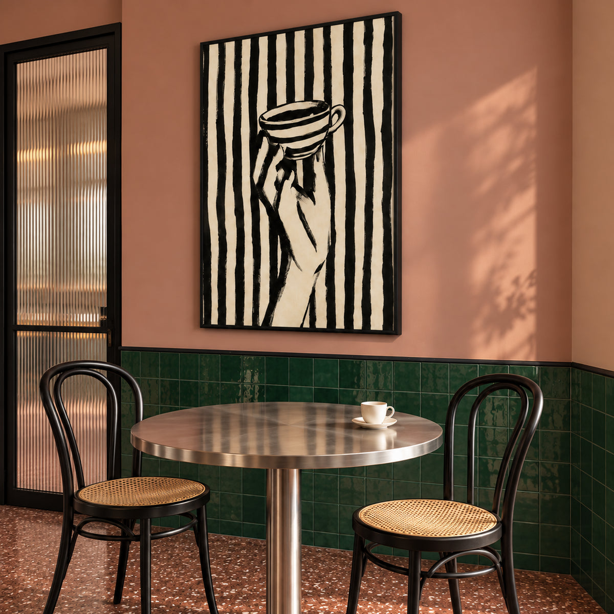 Angled view of The Espresso Hour, showing its slim black frame and portrait artwork above a round café table.