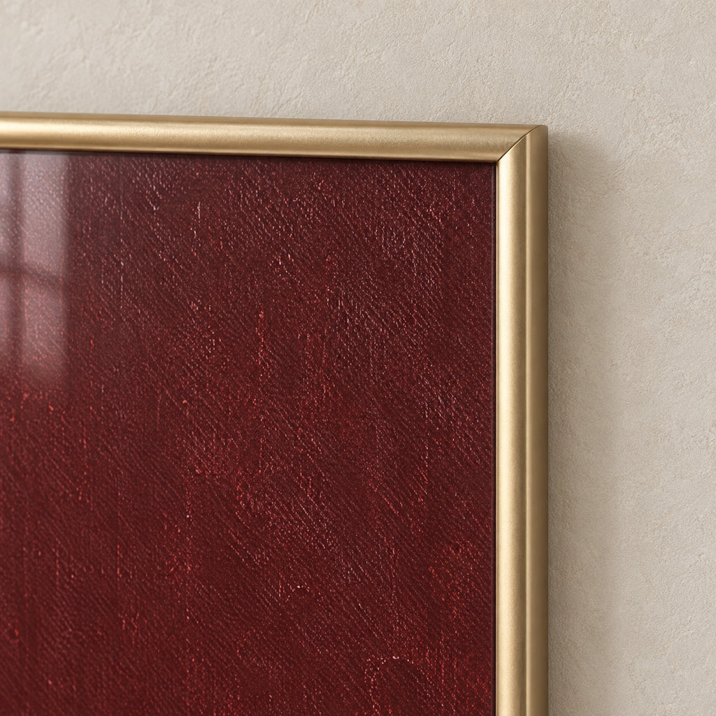 Top-right corner detail of The Burgundy Muse, showing the rounded satin-gold frame, mitred joint and glass over the burgundy print.
