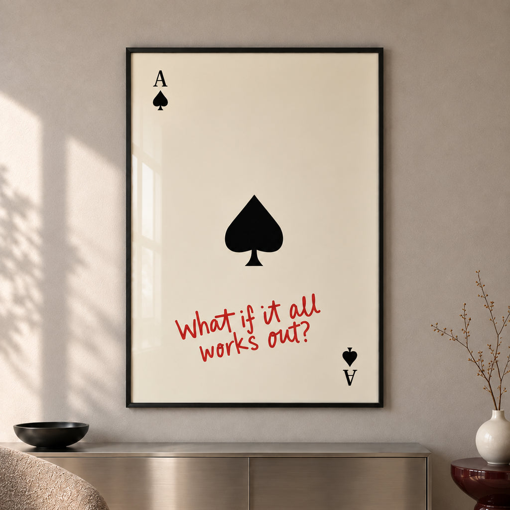Frontal close-up of The Optimist’s Ace, showing the black spade, playing-card corner symbols and red handwritten quote, with all four black frame edges visible.